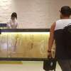 Heading up to the check-in counter as our taxi drives away with our hotel voucher.